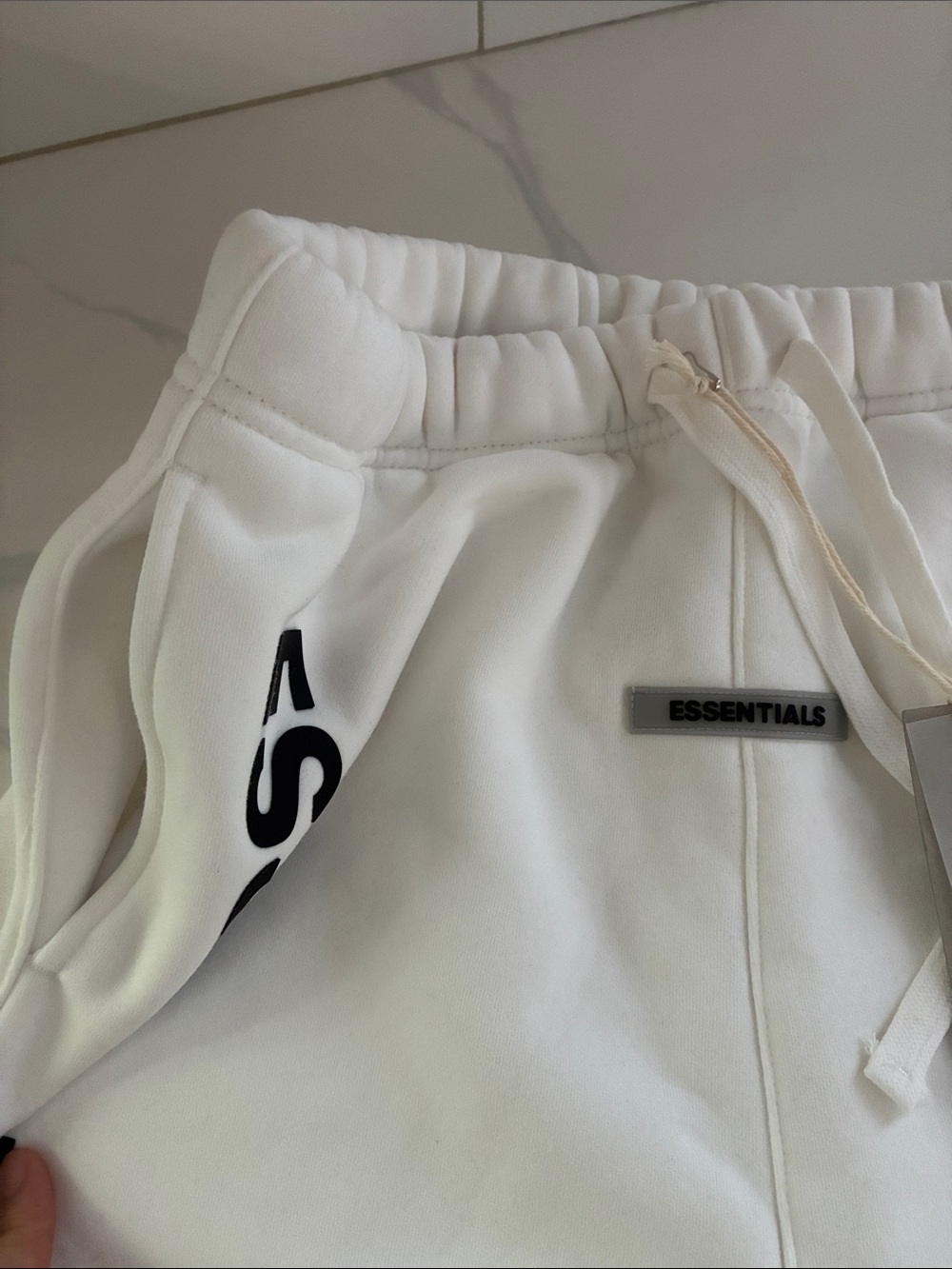 Essentials Men’s White Logo Athletic Shorts - Picture 2 of 3